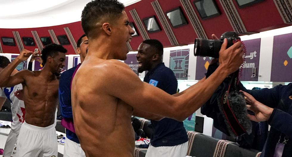 Madness in France: Players throw a party in the dressing room after advancing in the World Cup.