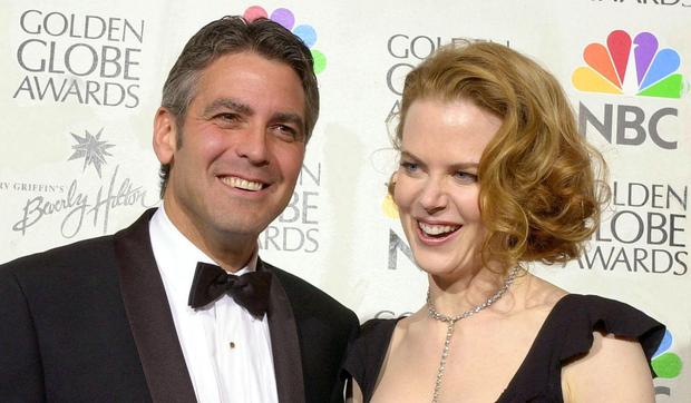 George Clooney and Nichole Kidman after winning Best Performance for their role in the film "Oh Brother Where Art Thou" at the 58th edition of the Golden Globes in Beverly Hills, California, on January 21, 2001 (Photo: Lucy Nicholson / AFP)